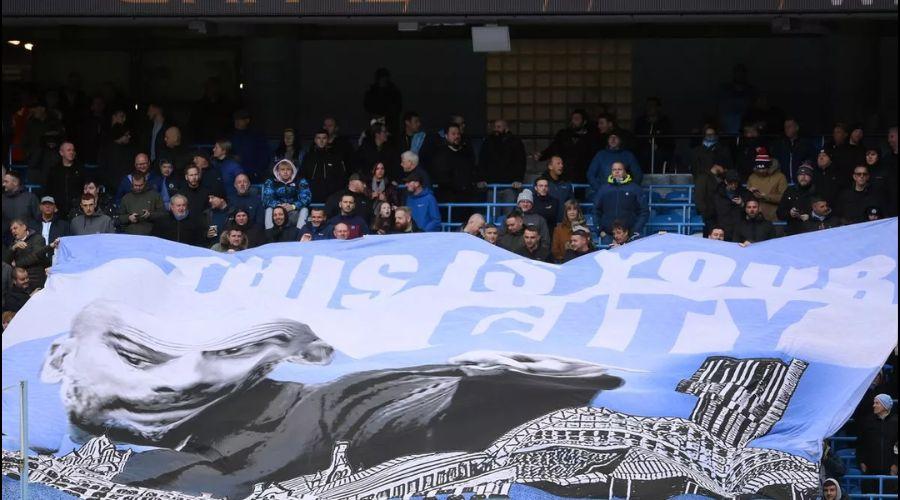 Man City Fans' Banner: 'Pep Guardiola - Volem que et Quedis!' Meaning Explained